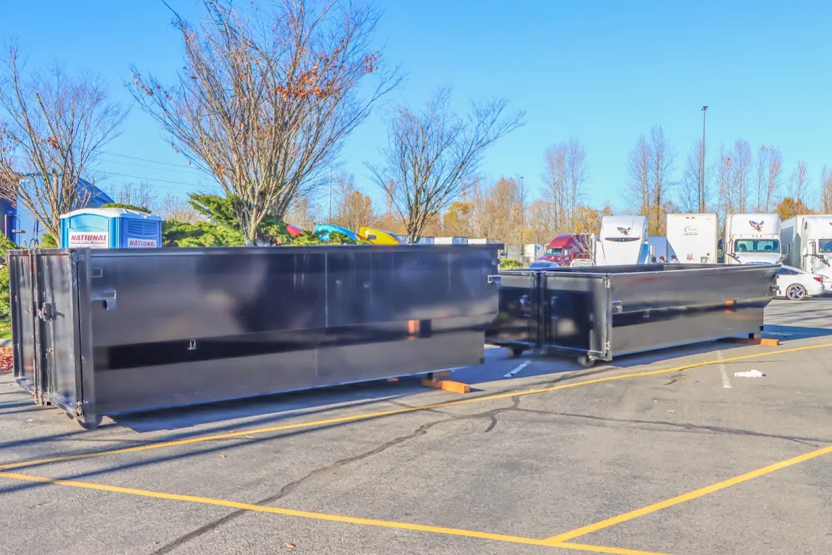 Professional dumpster rental service with roll-off container on residential driveway in Oak Forest